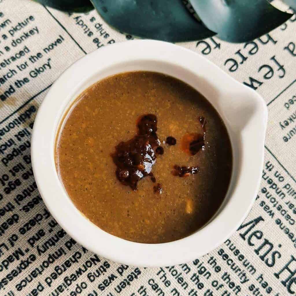 "Hoisin Peanut Sauce" - A dipping bowl filled with creamy and flavorful Vietnamese Peanut Sauce with some Vietnamese chili oil on top