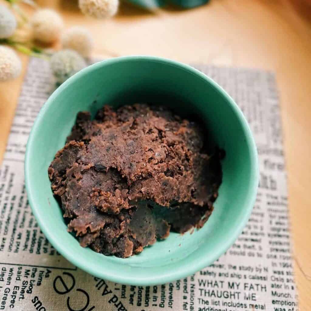 Tsubuan (Japanese chunky sweet red bean paste) in a Aqua Green Bowl on the table.