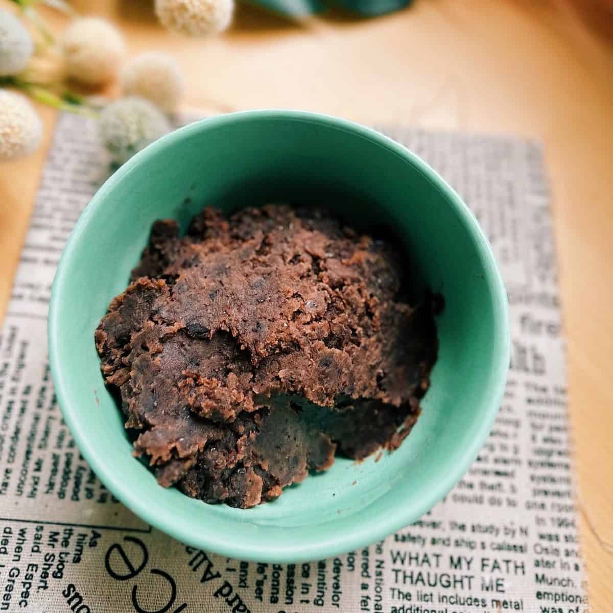 Tsubuan (Japanese chunky sweet red bean paste) in a Aqua Green Bowl on the table.