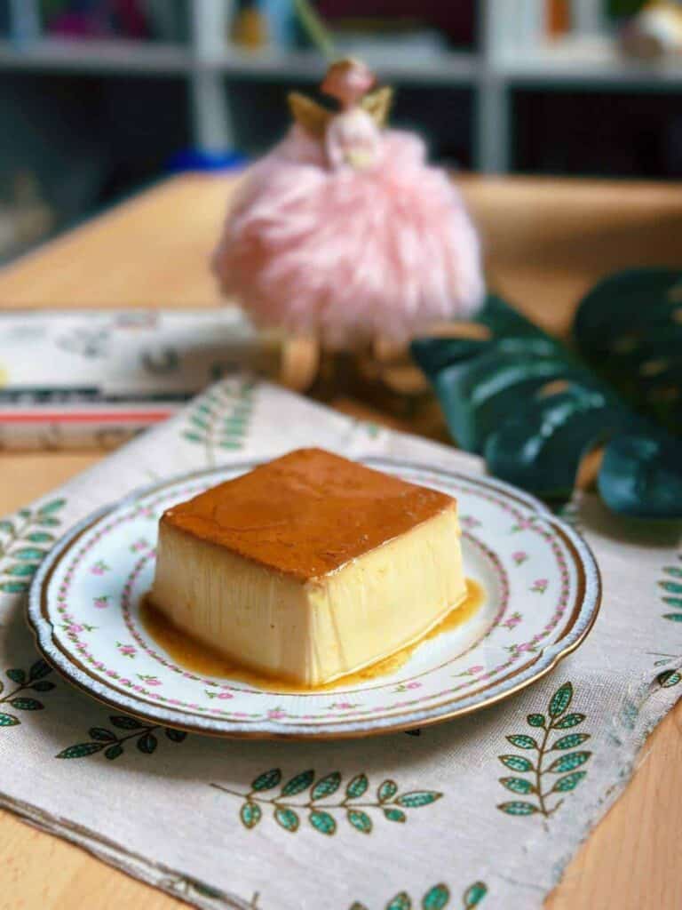Mini flan recipe: A Single Serve Flan on a plate with caramel sauce on top.