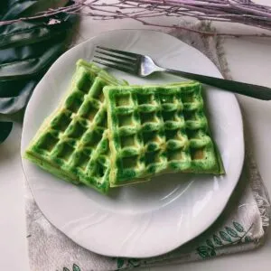 Vietnamese Hot Dogs (Triangle Cakes) Photo of Coconut Pandan Waffles (Banh Kep La Dua), a delectable pandan waffle recipe, displaying the golden-brown, crispy exterior and the tender, fluffy interior of the waffles, infused with the irresistible aroma and vibrant green color of pandan.