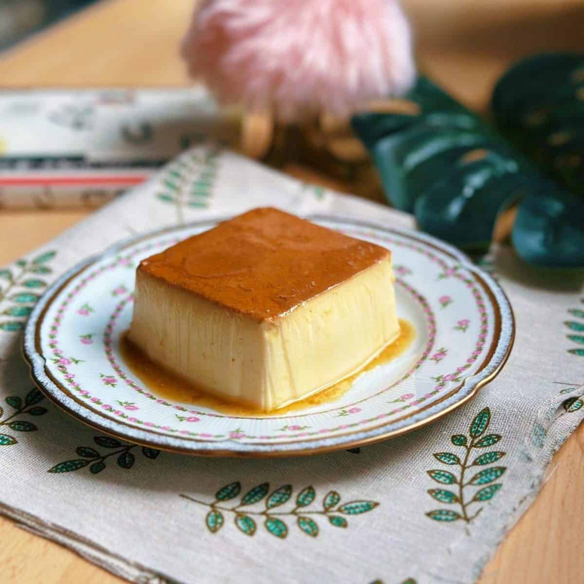 Mini flan recipe: A Single Serve Flan on a plate with caramel sauce on top.