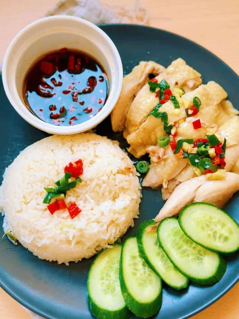 Delicious and aromatic Instant Pot Hainan Chicken Rice, served with juicy chicken, fluffy rice, and delectable sauces.