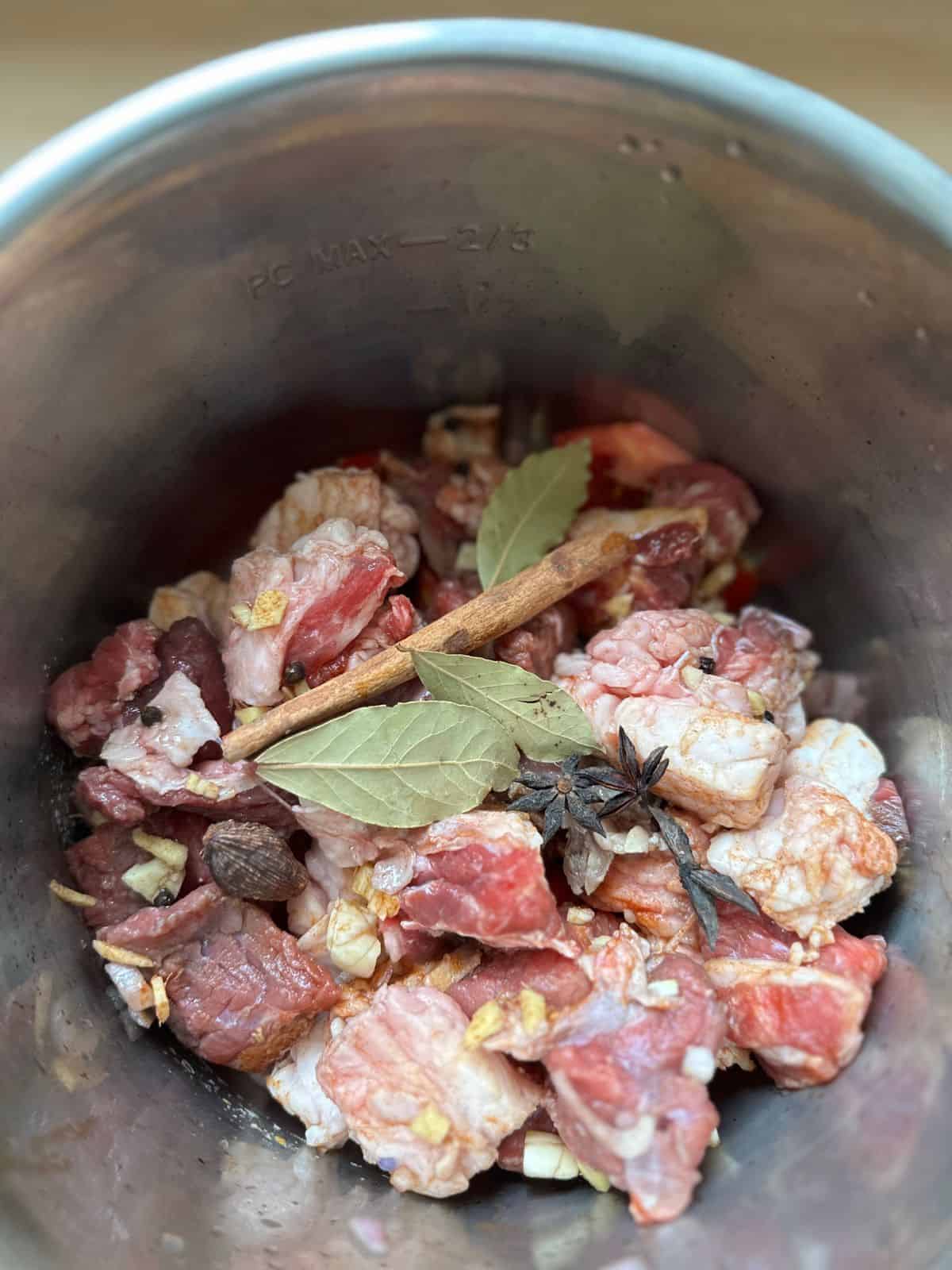 add beef and all spices to the pot