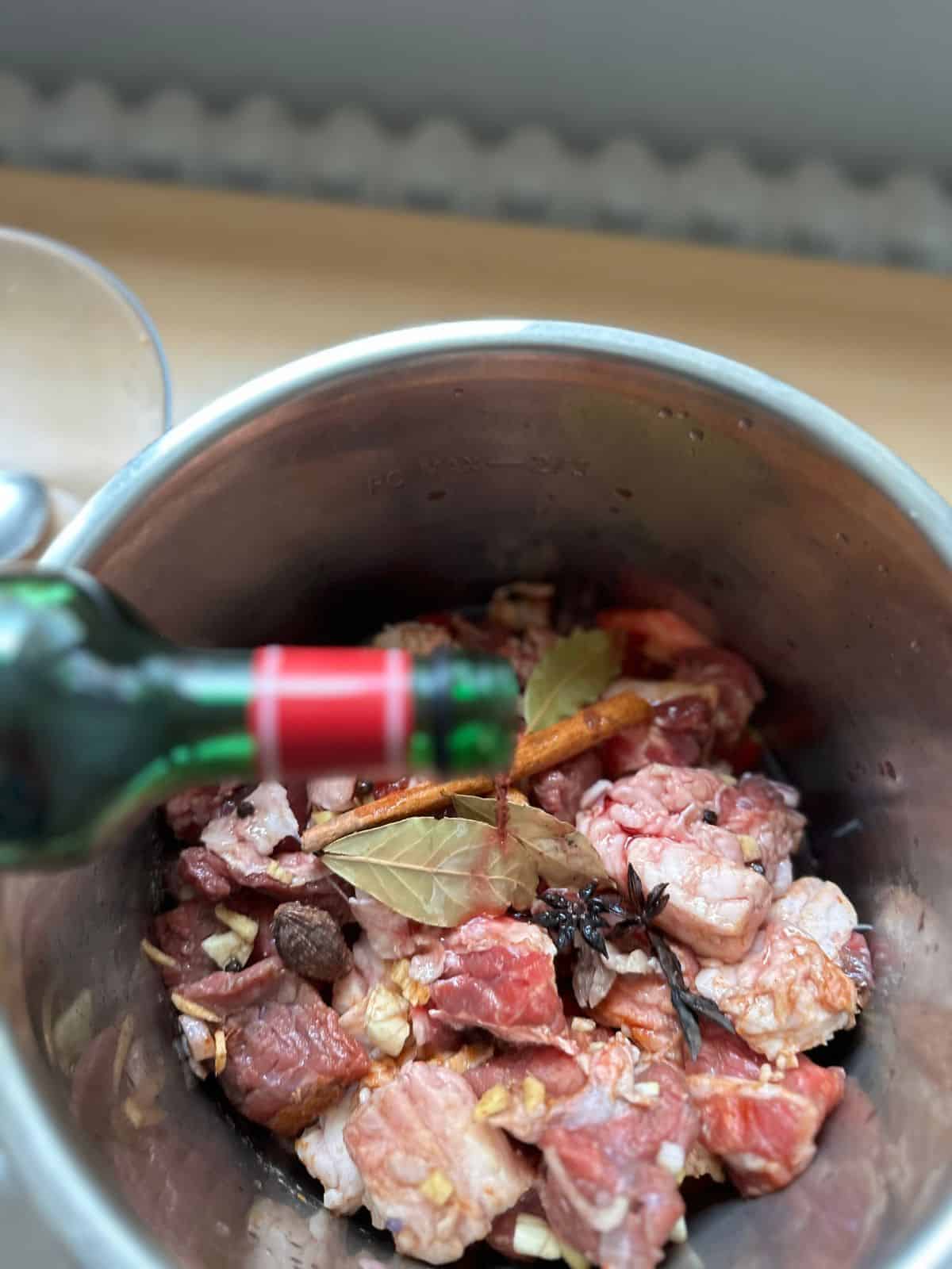 pour the red wine to the mixture