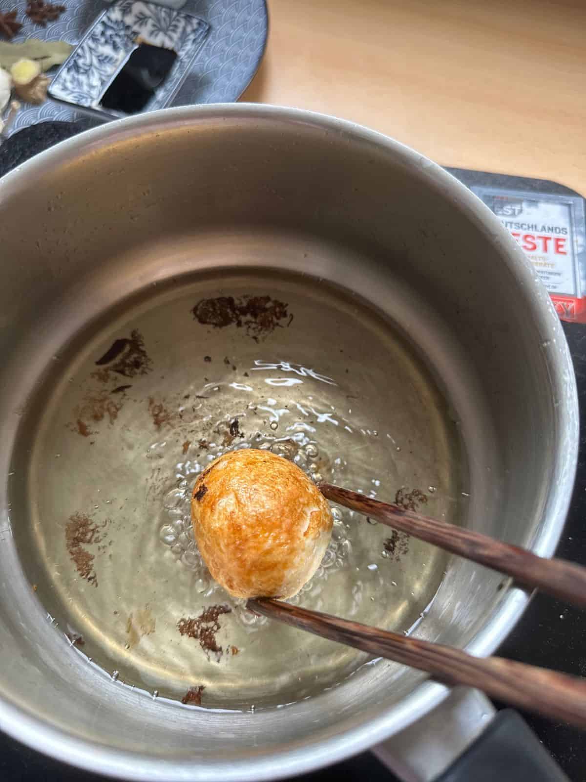 Friy hard-boiled eggs in cooking oil