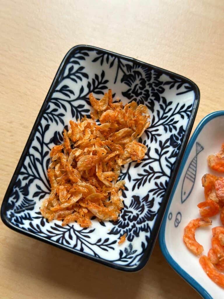 Xôi Mặn | Xôi Lạp Xưởng (Chinese Sausage Sticky Rice) dried shrimps in a saucer