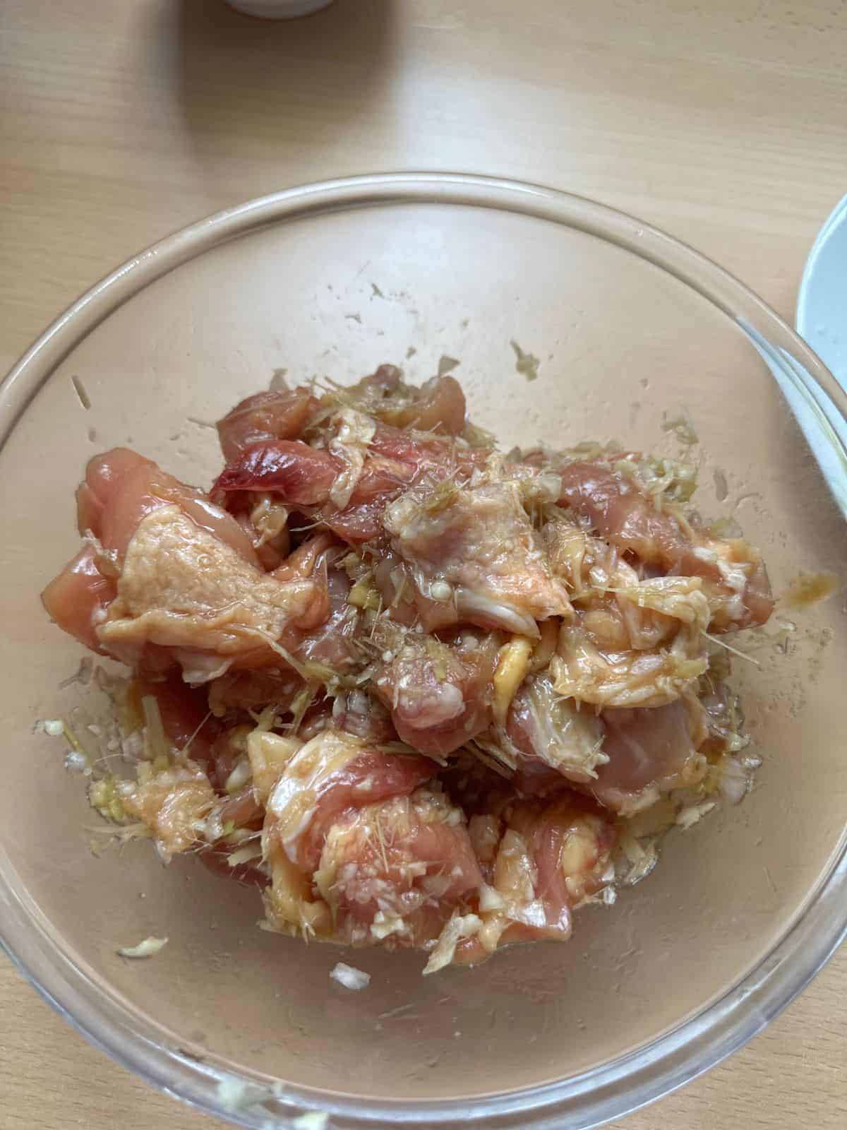 Mom's Easy Gà Xào Xả Ớt (Spicy Lemongrass Chicken) marinated chicken in a bowl with all spices and seasonings