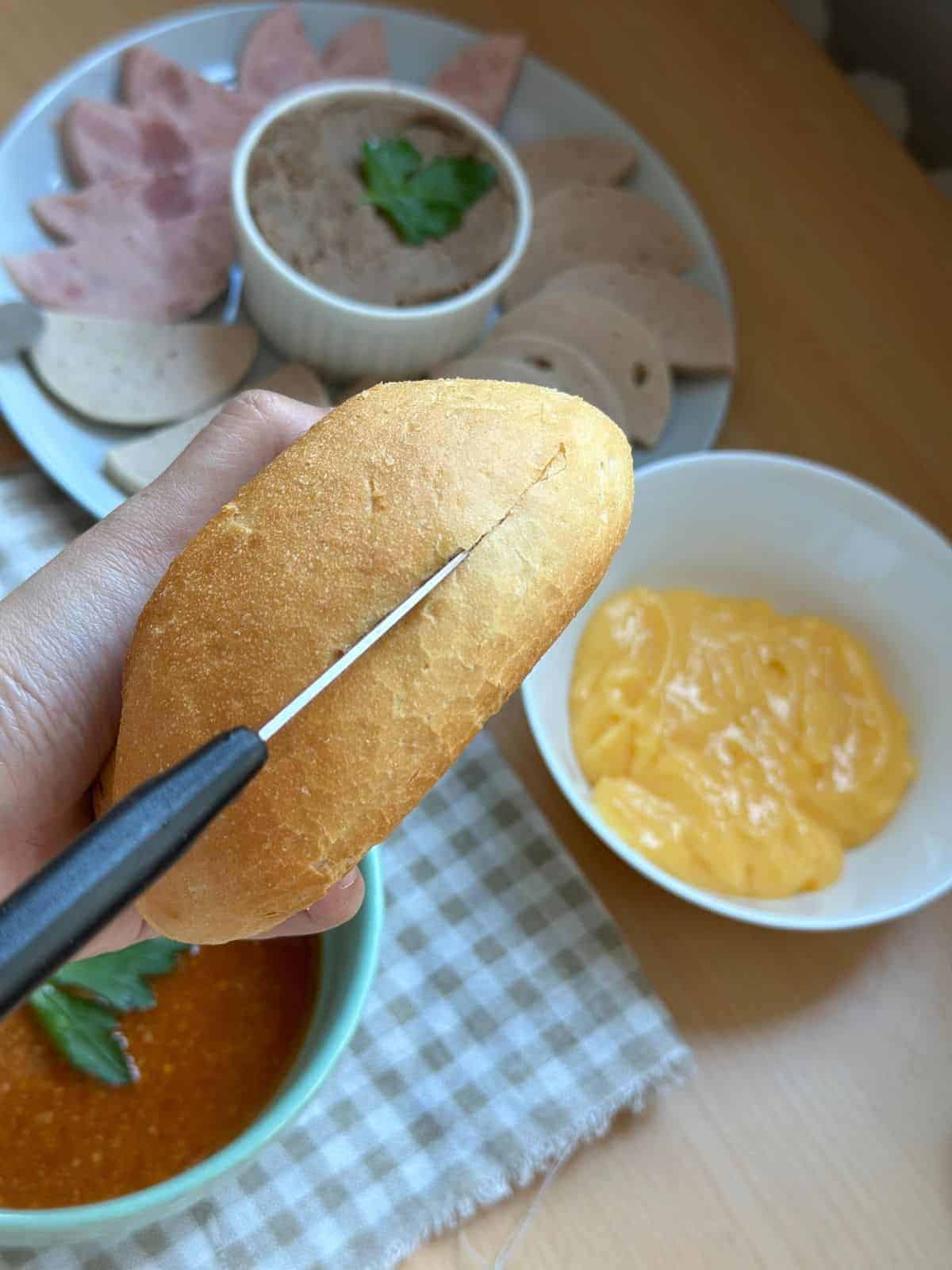 Best Authentic Banh Mi Recipe (Vietnamese Sandwich) Slice the roll down the top middle.