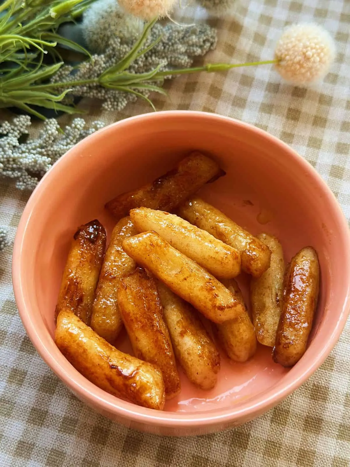 Easy Honey Butter Tteokbokki (Non Spicy) Honey Butter Tteokbokki - A Korean snack with chewy rice cakes in a sweet and buttery sauce