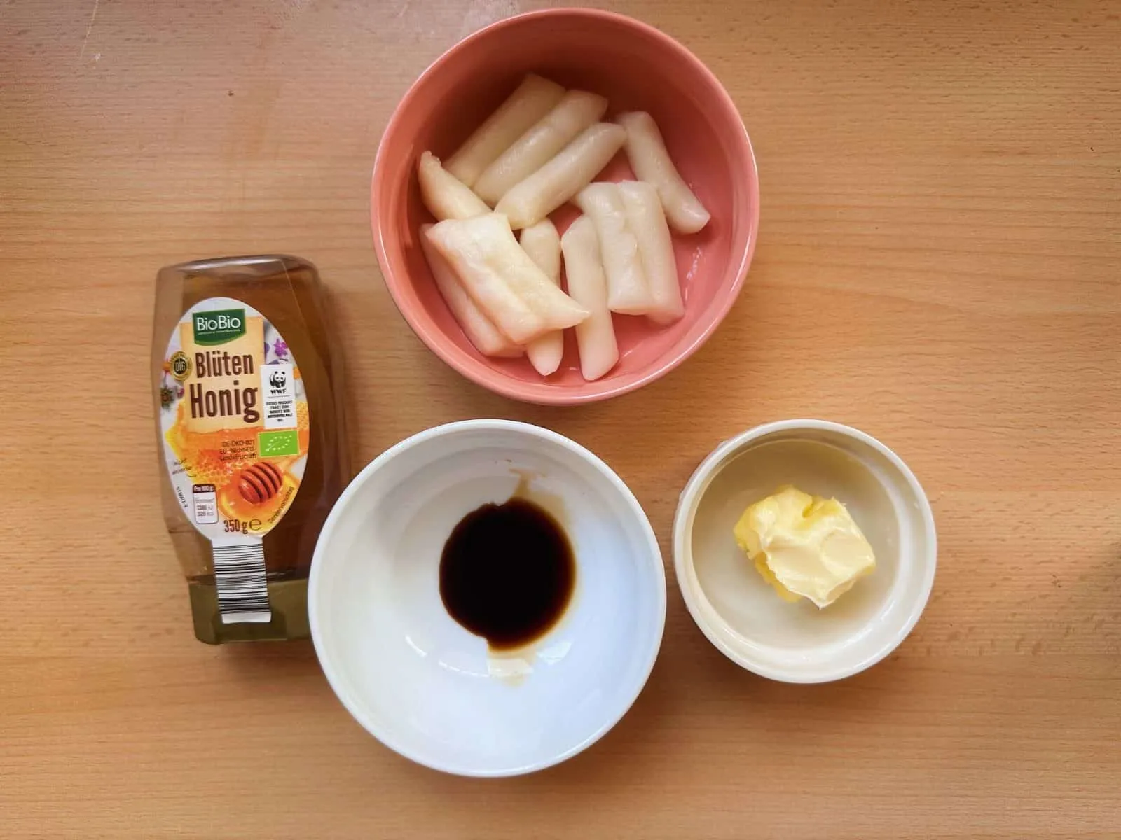 Easy Honey Butter Tteokbokki (Non Spicy) Ingredients for Honey Butter Tteokbokki, including Korean Rice Cakes, Butter, Honey & Soy Sauce
