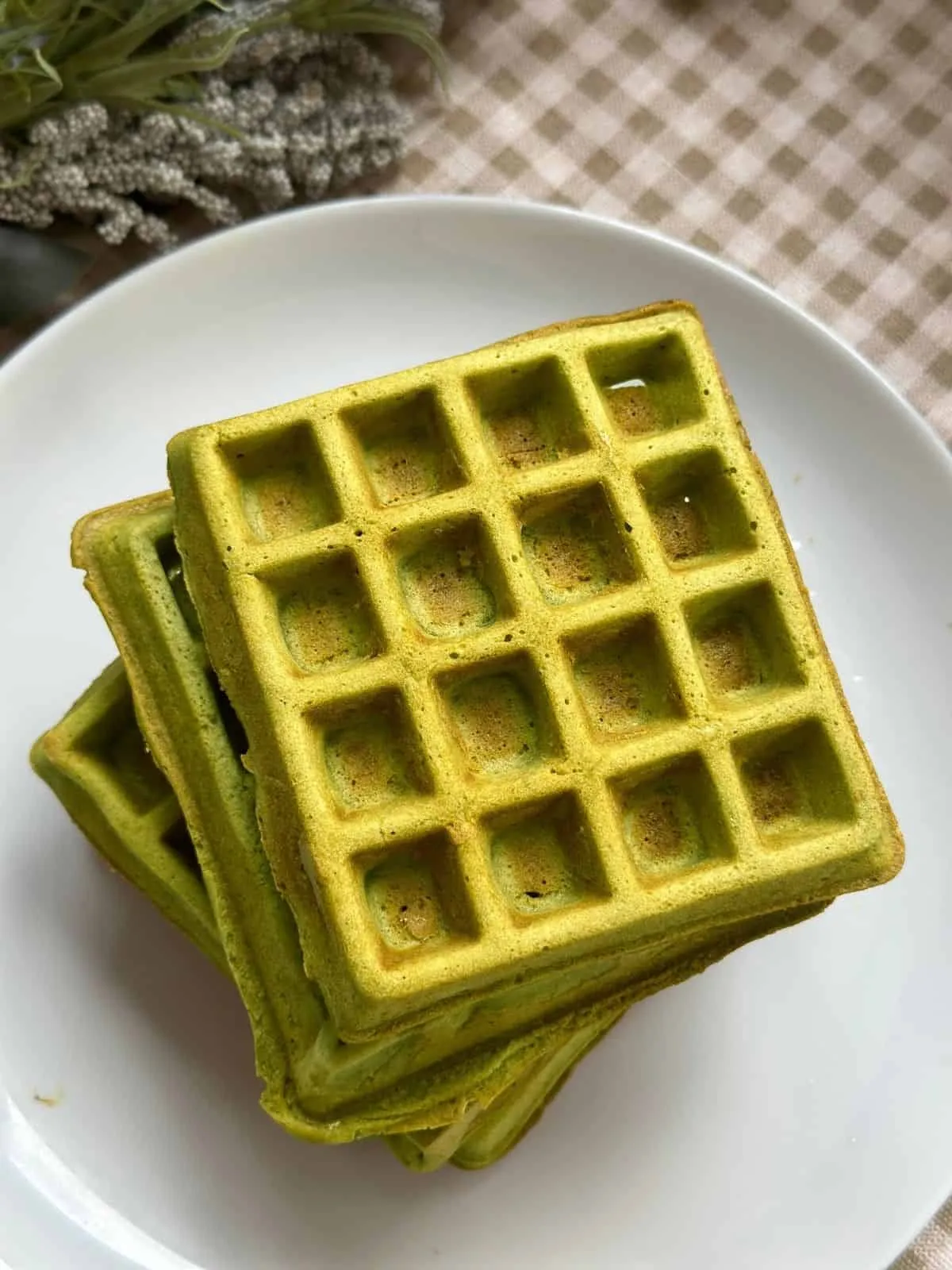 Easy Green Tea / Matcha Waffles (with Buttermilk) Freshly made matcha waffles with a golden crispy exterior and a soft green tea-infused interior.