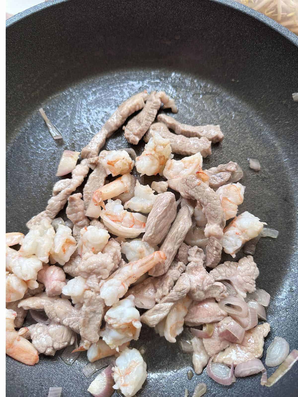 No-Fuss Bánh Xèo Waffles Stir-fry pork and shrimps for the filling of Banh Xeo.