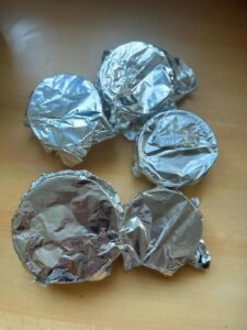 Cover the ramekins with aluminum foil.