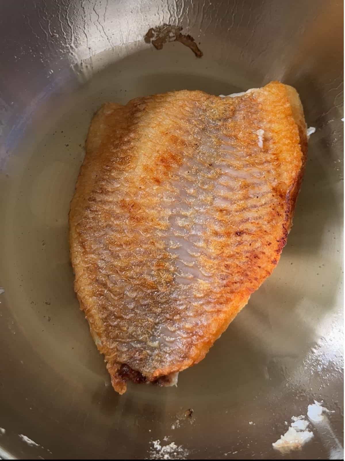 Easy Vietnamese Fried Fish - Cá Chiên Fry the fish on both sides.