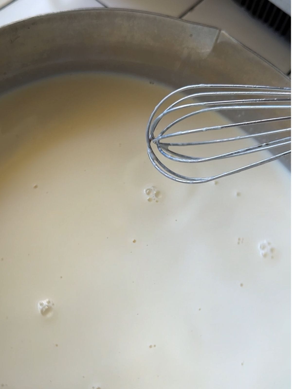 Vietnamese Yogurt (Mom's Sữa Chua / Da Ua Recipe) Heat up the milk and condensed milk.