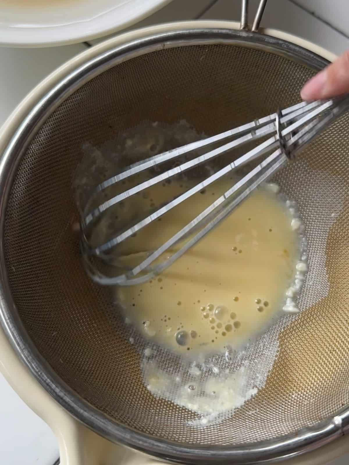 Thạch Rau Câu Flan Cà Phê (Vietnamese Coffee Flan Jelly) Strain the mixture to remove any lumps.