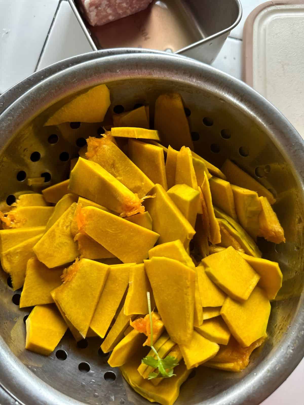 Simple Vietnamese Pumpkin Soup (Canh Bí Đỏ) Thinly sliced pumpkin