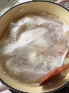 Cover the meat with baking paper.