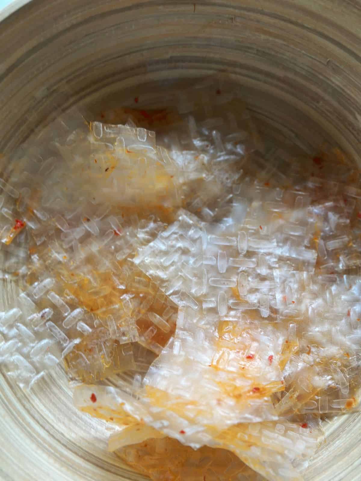 Easy Bánh Tráng Trộn (Vietnamese Rice Paper Salad) Toss rice papers with sauce.