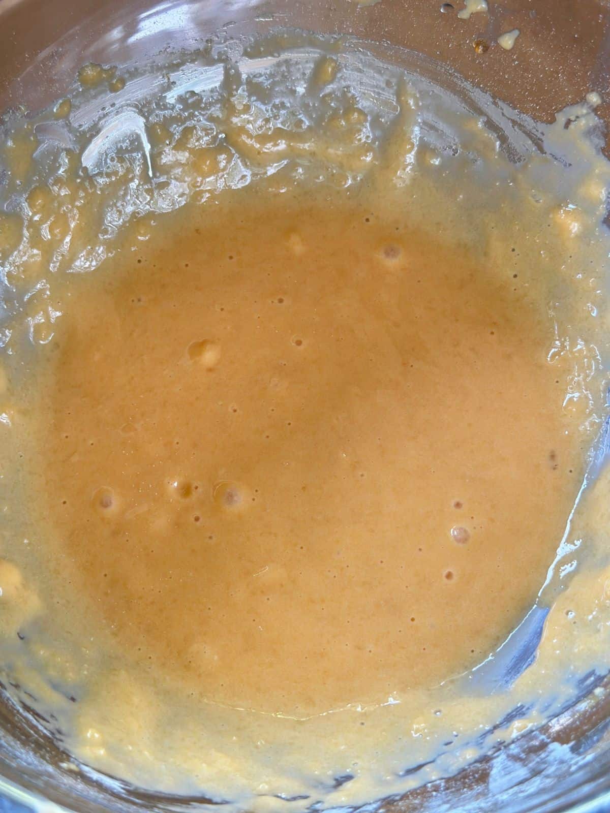 Fluffiger Chiffon Kuchen / Chiffon Cake / シフォンケーキ Egg yolk batter in a glass bowl, smooth and lightly golden, showing early stage of chiffon cake preparation