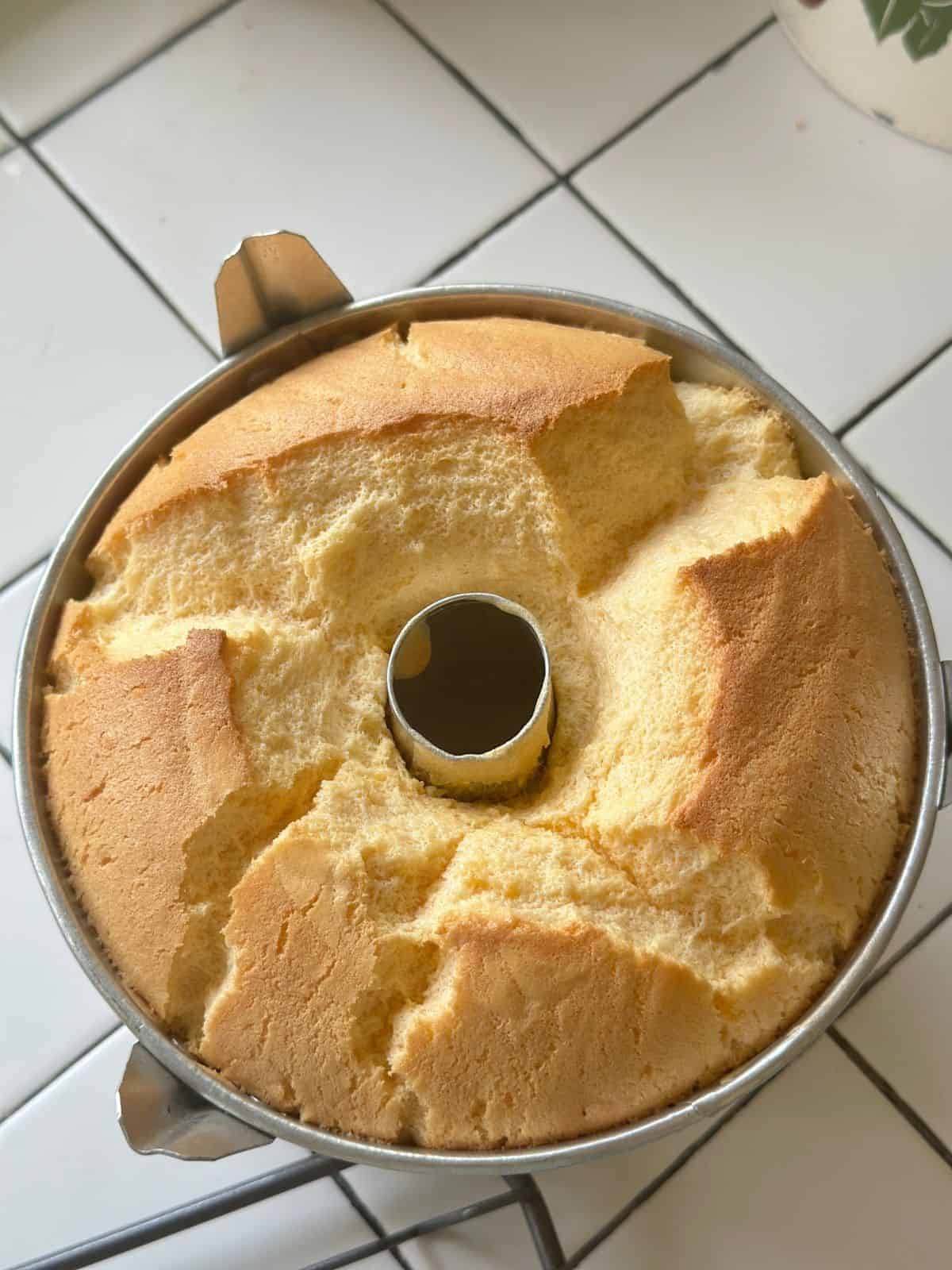 Fluffiger Chiffon Kuchen / Chiffon Cake / シフォンケーキ Freshly baked Chinese chiffon cake in a tube pan with a cracked, golden brown top.