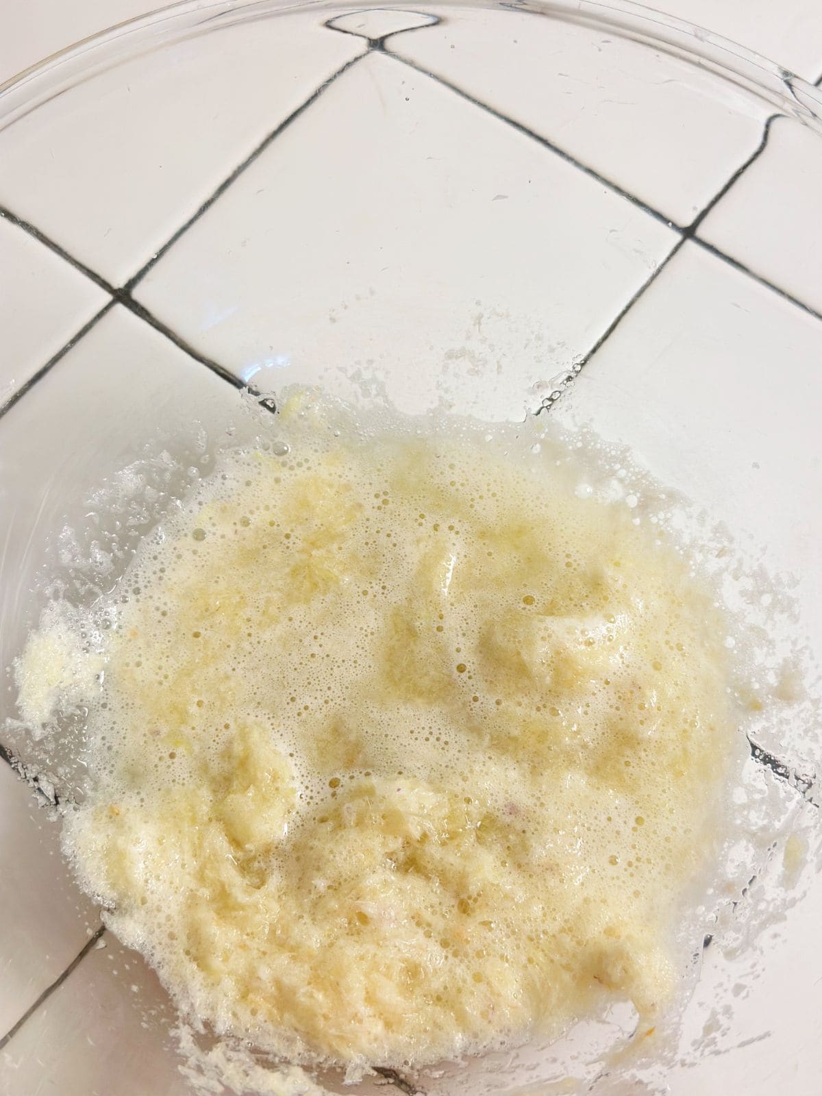 Blended garlic, shallots, and lemongrass in a small bowl for Vietnamese grilled pork marinade
