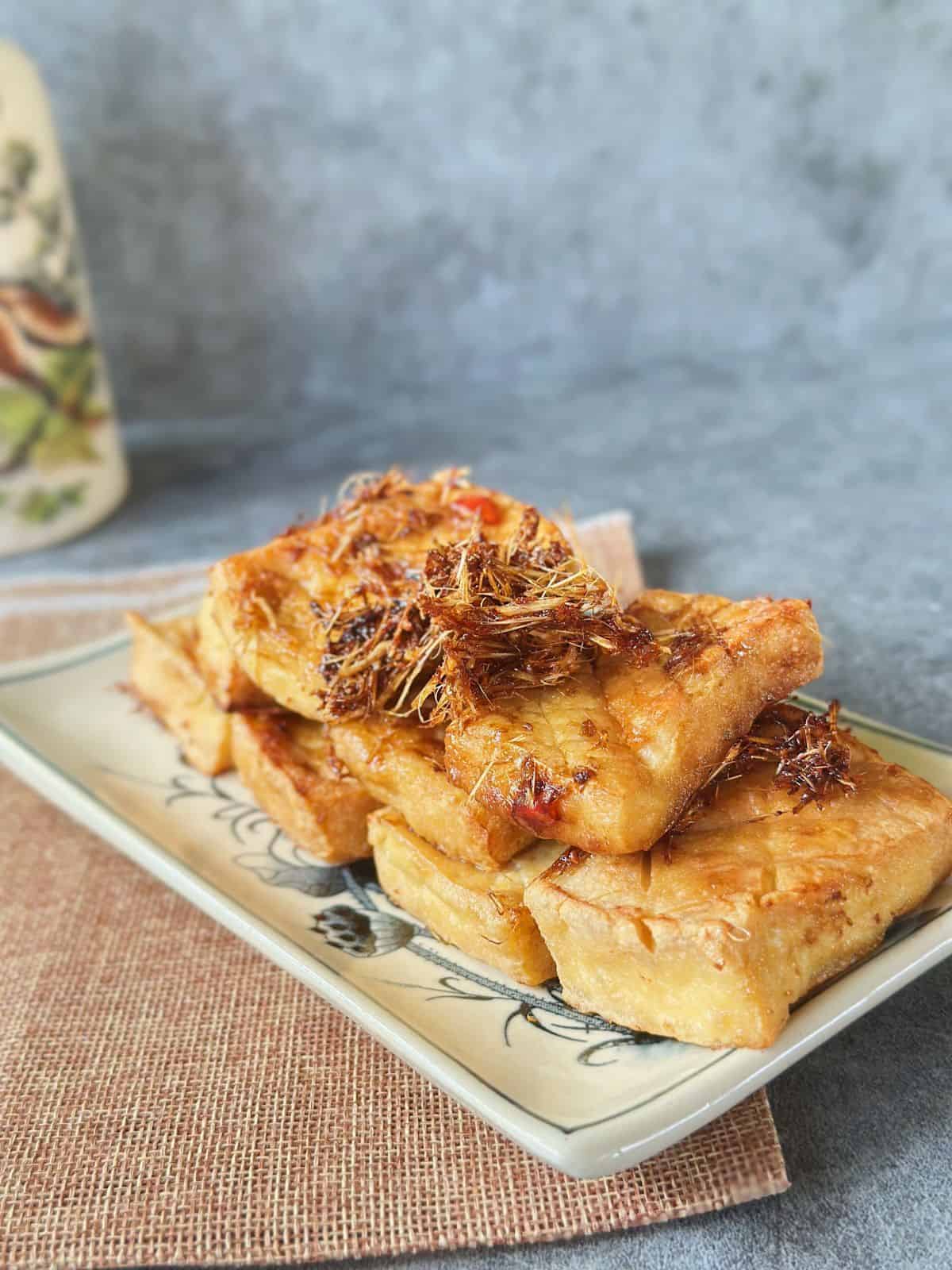 A plate of crispy Vietnamese lemongrass tofu, glazed in aromatic lemongrass and chili.